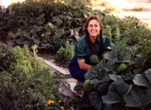 Community members working in postage-stamp gardens